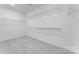 A well-lit walk-in closet has ample storage with racks at 136 Glenn Dr, Mooresville, NC 28115