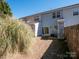 Backyard of a townhome featuring a patio and fenced-in area at 13684 Meade Glen Ct, Charlotte, NC 28273