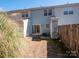 Backyard of a townhome featuring a patio and fenced-in area at 13684 Meade Glen Ct, Charlotte, NC 28273