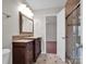 Bathroom featuring double vanities and walk-in shower at 13684 Meade Glen Ct, Charlotte, NC 28273