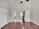 Bedroom featuring two doors, a closet, and hardwood flooring at 13684 Meade Glen Ct, Charlotte, NC 28273