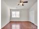 Spacious bedroom features a ceiling fan, natural light, and a closet at 13684 Meade Glen Ct, Charlotte, NC 28273