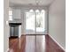 Dining area featuring hardwood floors and a sliding glass door at 13684 Meade Glen Ct, Charlotte, NC 28273