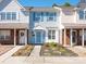 Charming townhome featuring light blue siding and well-maintained landscaping at 13684 Meade Glen Ct, Charlotte, NC 28273