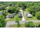 Aerial view of home showcasing well-manicured lawn, long driveway, and lush landscaping at 1532 South Point Rd, Belmont, NC 28012