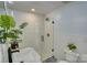 Well lit bathroom with glass enclosed shower, modern fixtures, and tile floor at 1532 South Point Rd, Belmont, NC 28012