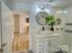 Beautifully updated bathroom with a large mirror, modern fixtures, and glass-enclosed shower at 1532 South Point Rd, Belmont, NC 28012