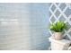 This bathroom's blue subway tile is complimented by designer wallpaper and a modern toilet at 1532 South Point Rd, Belmont, NC 28012