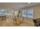 Dining area with a table and a view into the kitchen with light colored cabinets at 1532 South Point Rd, Belmont, NC 28012
