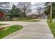 Expansive driveway leads to home, garage, and guest house surrounded by mature trees at 1532 South Point Rd, Belmont, NC 28012