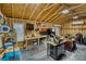 Garage interior featuring a workbench, tools, and a television, creating a functional workspace at 1532 South Point Rd, Belmont, NC 28012