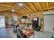 Brightly lit garage interior featuring a desk, work area, and ample storage, ideal for various projects at 1532 South Point Rd, Belmont, NC 28012