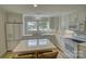 Bright kitchen featuring white cabinets, stainless steel appliances, and a central island at 1532 South Point Rd, Belmont, NC 28012