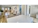 Bright open-concept kitchen with eat-in bar and views of the living area at 1532 South Point Rd, Belmont, NC 28012