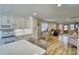 Open-concept living area with updated kitchen, hardwood floors, and ample seating at 1532 South Point Rd, Belmont, NC 28012