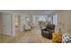 Open-concept living room with hardwood floors and a view to the kitchen beyond at 1532 South Point Rd, Belmont, NC 28012