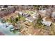 Aerial view of lakefront homes with private docks, lush landscaping, and lake access at 156 Hazelton Loop, Mooresville, NC 28117