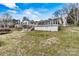 Spacious home featuring a covered porch, rear deck, and basement garage access points at 156 Hazelton Loop, Mooresville, NC 28117