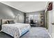 Inviting bedroom with neutral carpet, a queen bed, and a well-lit desk area for work or study at 156 Hazelton Loop, Mooresville, NC 28117