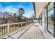 Lovely deck with lake view, featuring composite decking, and black aluminum railings at 156 Hazelton Loop, Mooresville, NC 28117
