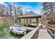 A private boat slip with motorized boat lift and jet ski lift offers lake access at 156 Hazelton Loop, Mooresville, NC 28117