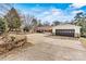 View of the home featuring an attached garage and spacious driveway at 156 Hazelton Loop, Mooresville, NC 28117
