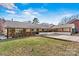 Charming single-story home with a stone facade, covered entryway, and a spacious front lawn at 156 Hazelton Loop, Mooresville, NC 28117