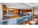 Spacious kitchen featuring wood cabinetry, granite counters, and stainless steel appliances at 156 Hazelton Loop, Mooresville, NC 28117