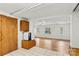 Bright living room with hardwood floors, light walls, and large windows overlooking the yard at 156 Hazelton Loop, Mooresville, NC 28117