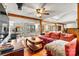 Cozy living room showcasing hardwood floors, a ceiling fan, and ample natural light at 156 Hazelton Loop, Mooresville, NC 28117