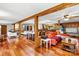Expansive living space with hardwood floors connecting multiple seating and dining areas, and kitchen at 156 Hazelton Loop, Mooresville, NC 28117