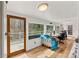 Sun-filled room featuring hardwood floors, a view of the deck, and ample natural light at 156 Hazelton Loop, Mooresville, NC 28117