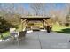 Backyard featuring a shaded gazebo with outdoor seating, a grill, and a patio at 2000 Willowcrest Dr, Waxhaw, NC 28173
