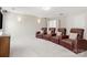 Finished basement featuring three leather theater chairs and a mounted TV at 2000 Willowcrest Dr, Waxhaw, NC 28173
