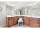 Spacious bathroom featuring dual sinks, wooden cabinets, and a well-lit mirror at 2000 Willowcrest Dr, Waxhaw, NC 28173