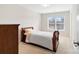 Comfortable bedroom with natural light, carpet, and an interior door at 2000 Willowcrest Dr, Waxhaw, NC 28173