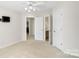 Spacious carpeted bedroom featuring lots of natural light, and an ensuite bathroom at 2000 Willowcrest Dr, Waxhaw, NC 28173