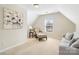 Cozy bedroom space featuring a comfortable chair and ottoman with a well-lit window at 2000 Willowcrest Dr, Waxhaw, NC 28173