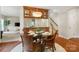 Inviting dining area with custom built-in cabinetry conveniently situated to the kitchen and stairs to upper level at 2000 Willowcrest Dr, Waxhaw, NC 28173