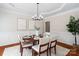 Bright dining room with tray ceilings, a chandelier, and elegant furniture at 2000 Willowcrest Dr, Waxhaw, NC 28173