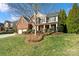 Attractive home with brick and siding, a well-kept lawn, and mature trees at 2000 Willowcrest Dr, Waxhaw, NC 28173