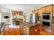Eat-in kitchen with stainless steel appliances, hardwood flooring, and a central island perfect for culinary enthusiasts at 2000 Willowcrest Dr, Waxhaw, NC 28173