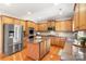 Spacious kitchen equipped with stainless steel appliances, custom cabinets, and a convenient center island at 2000 Willowcrest Dr, Waxhaw, NC 28173