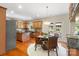 Well-appointed kitchen flows into the dining area with a view to the backyard, stainless appliances and wooden cabinetry at 2000 Willowcrest Dr, Waxhaw, NC 28173