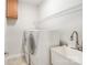 Functional laundry room featuring a sink, upper cabinets, and shelving to maximize storage at 2000 Willowcrest Dr, Waxhaw, NC 28173