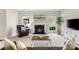 Living room featuring a cozy fireplace with a painting above and plush seating for relaxed living at 2000 Willowcrest Dr, Waxhaw, NC 28173