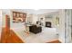 Bright living room featuring a fireplace, hardwood floors, and a view of the backyard from the doorway at 2000 Willowcrest Dr, Waxhaw, NC 28173