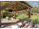 Relax in the outdoor gazebo with tv, seating, and bar, set in a fenced yard at 2000 Willowcrest Dr, Waxhaw, NC 28173