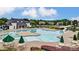 Community pool featuring a large swimming area, slide, and plenty of lounge chairs at 2000 Willowcrest Dr, Waxhaw, NC 28173