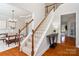 Elegant staircase with wooden railing leading to the upper level of the house at 2000 Willowcrest Dr, Waxhaw, NC 28173